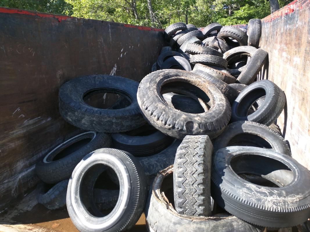 Dumpster filled with tires